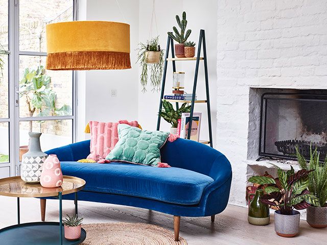 Oliver Bonas luna azure blue velvet sofa in white living room - goodhomesmagazine.com