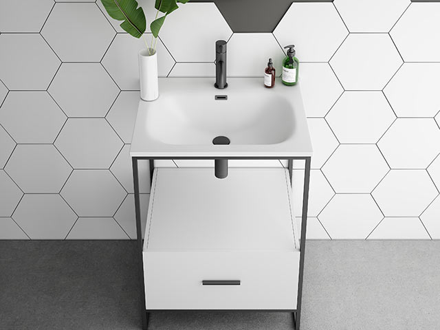 White basin with hexagon white wall tiles behind and drawer below