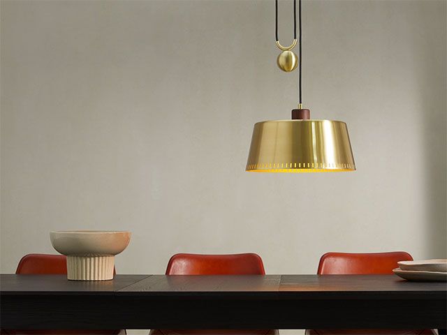 brass rise and fall pendant from made over dining table - goodhomesmagazine.com
