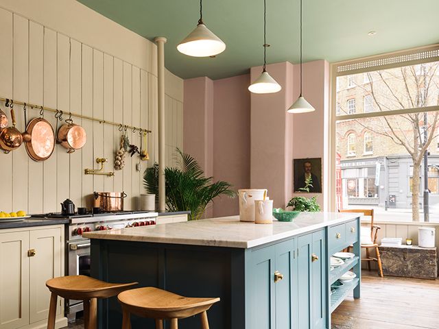 devol cabinets with green ceiling and pink walls at the st johns showroom 