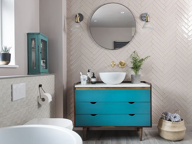 blue vanity unit in pale pink bathroom - goodhomesmagazine.com