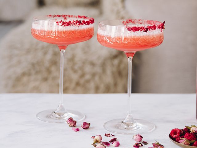 fruity valentines day cocktail recipe with rose-dusted glass - 4 valentine's day cocktail recipes - kitchen - goodhomesmagazine.com
