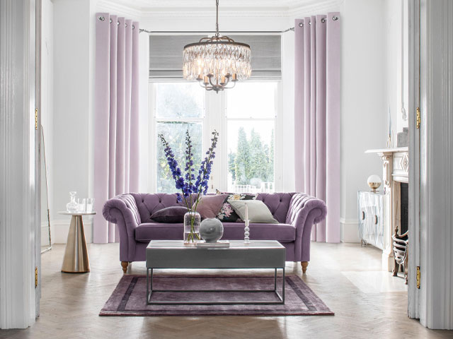 lavendar living room with purple sofa and lilac curtains, next home