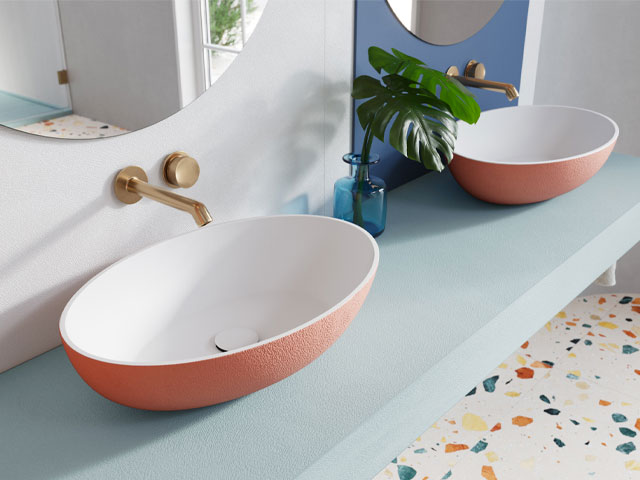muted coral and blue pastels in bathroom