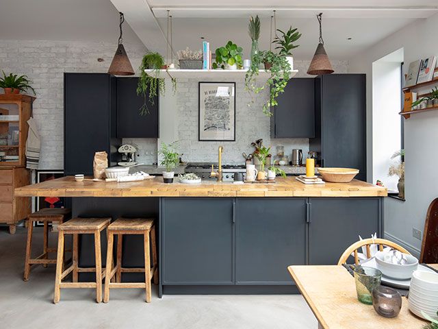 Grey kitchen island with plant hanging overhead - good homes january 2019 - goodhomesmagazine.com