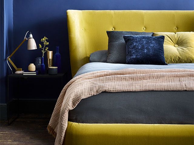 navy and yellow bedroom scheme with velvet bed - the top spring summer trends for 2020 - inspiration - goodhomesmagazine.com