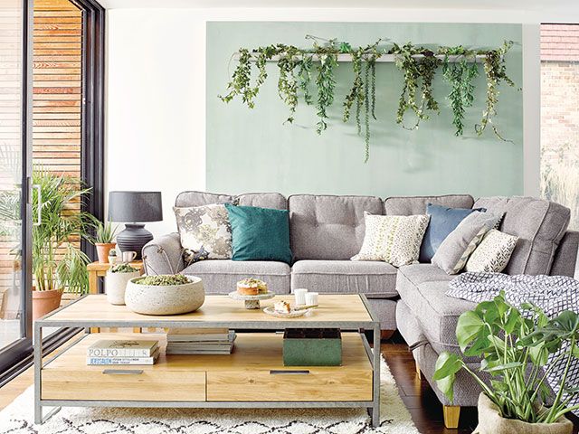 Plant filled living room with oak furnitureland furniture - goodhomesmagazine.com