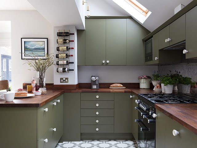 wood and green kitchen with white knobs - goodhomesmagazine.com