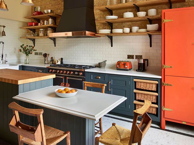 Harvey Jones grey kitchen with orange cupboard and copper accents - goodhomesmagazine.com