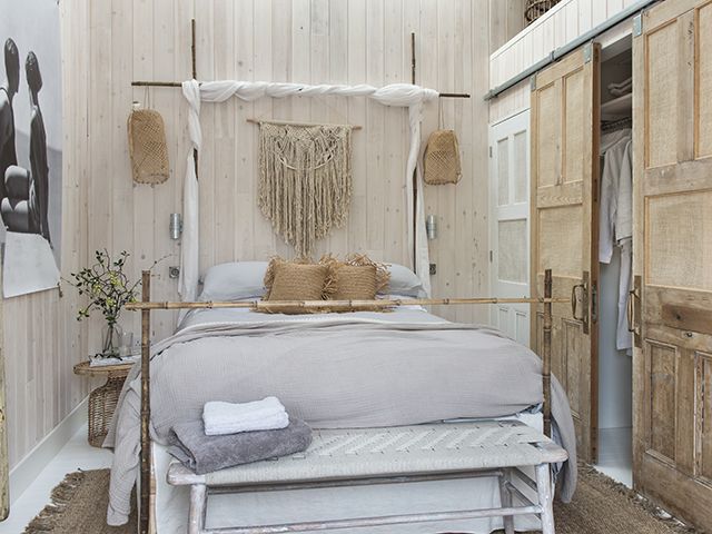 rustic cabin bedroom in cornish home - goodhomesmagazine.com