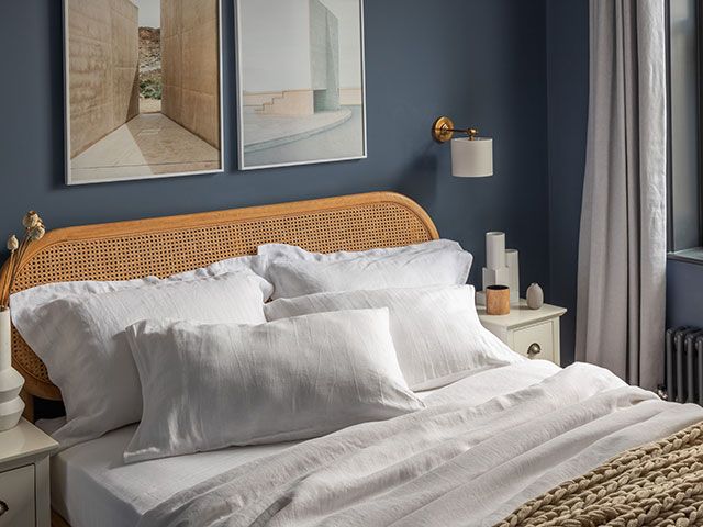 cosy bedroom with white linen bedding - goodhomesmagazine.com