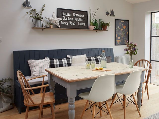 dining table with mix of chairs and banquette built in seating - goodhomesmagazine.com