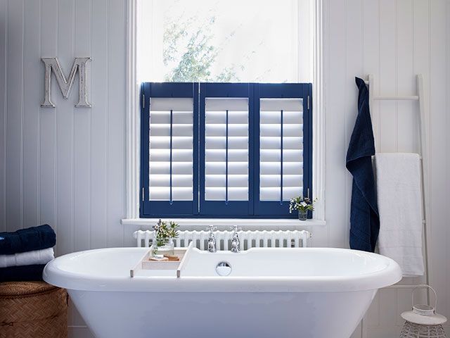 blue shutters in a nautical bathroom - goodhomesmagazine.com
