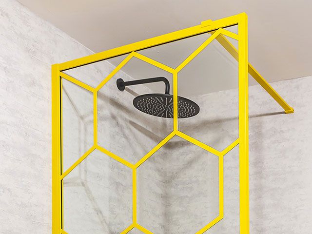 hexagon bathroom shower screen in bright yellow - goodhomesmagazine.com