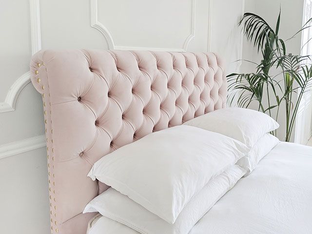 pink buttoned bed head with studs - goodhomesmagazine.com
