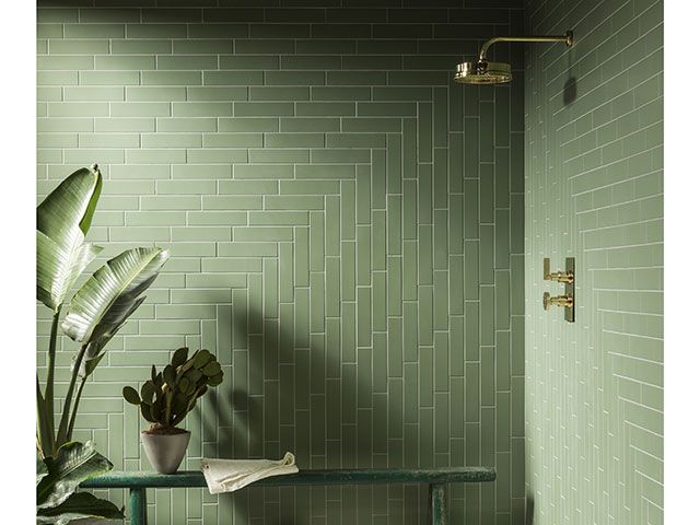 green bathroom with clever tile orientation - goodhomesmagazine.com