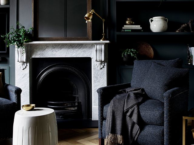 black living room with fireplace - black colour palette: our top picks - inspiration - goodhomesmagazine.com