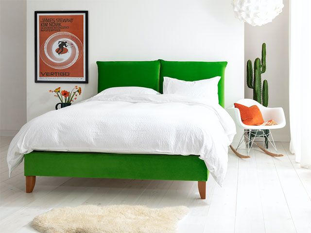 bright green double bed in white bedroom scheme - goodhomesmagazine.com