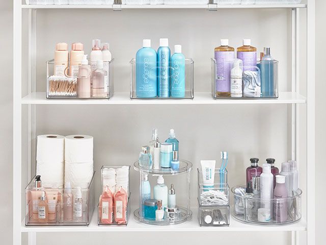 bathroom storage in clear boxes - goodhomesmagazine.com