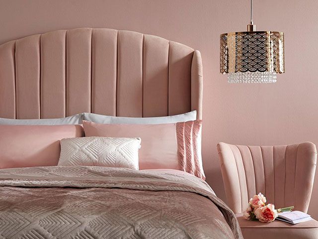 pink velvet bed head in pink bedroom - goodhomesmagazine.com