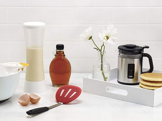 oxo batter dispenser in white kitchen with pancakes