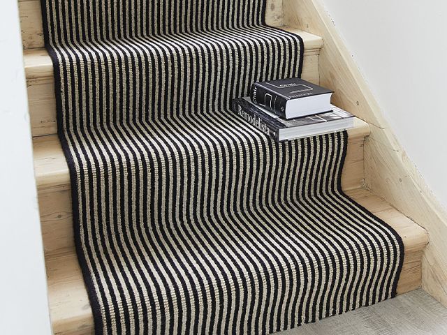 striped stair runner on hallway stairs