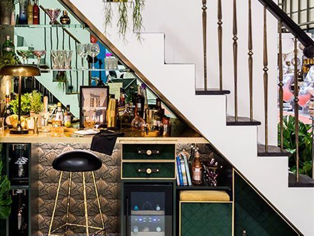 under the stairs bar - stylish decorating tips for your stairs - hallway - goodhomesmagazine.com