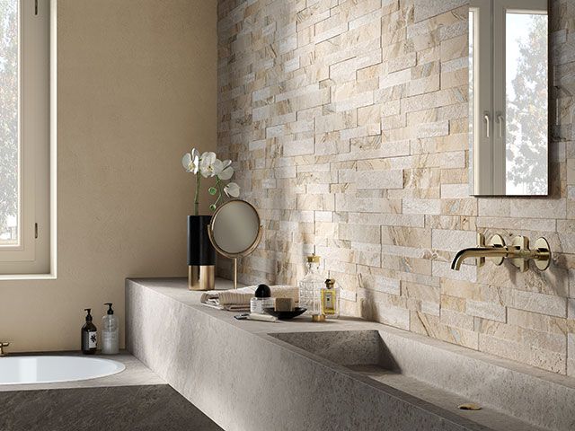 neutral bathroom with splitface wall tiles - good homes