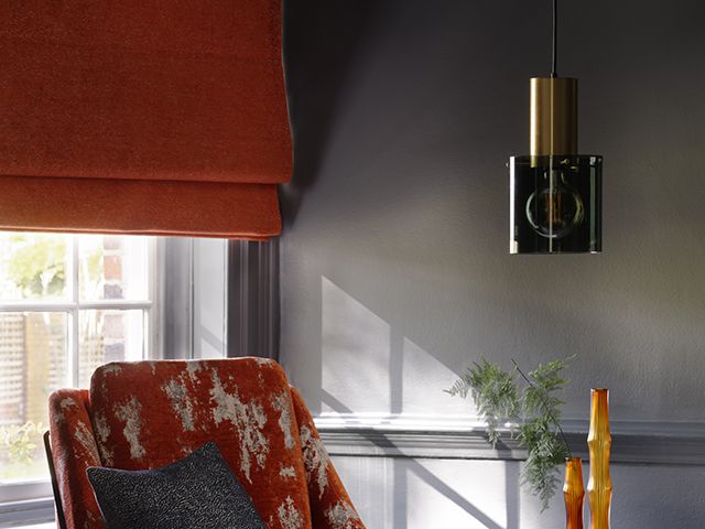 orange roman blind in a bedroom - inspiration - goodhomesmagazine.com