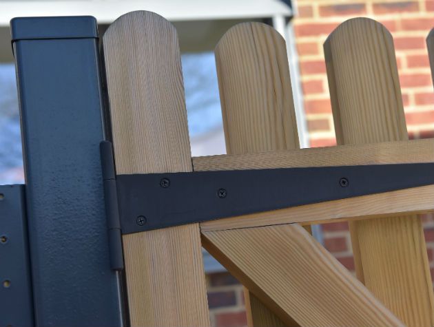 close up of garden gate and fence hinge