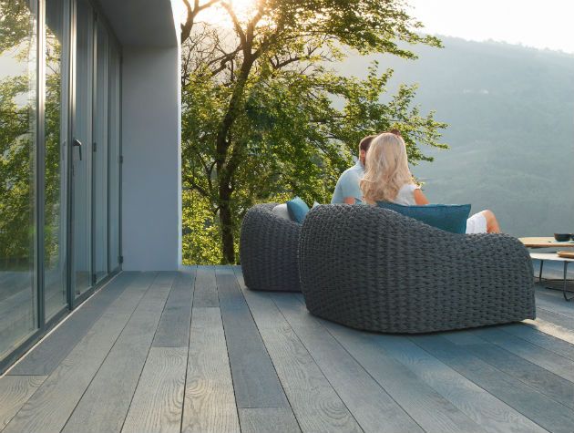 decking area with couple sat on outdoor seating