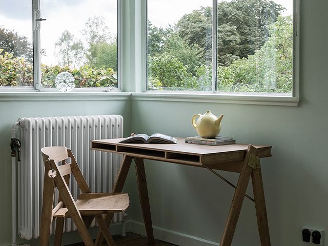 put your desk under a window for a light, bright work space 