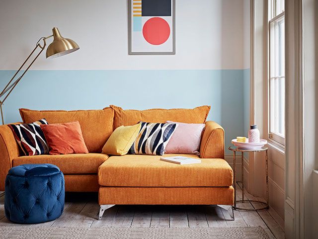 orange sofa - how to update your living room for spring - living room - goodhomesmagazine.com