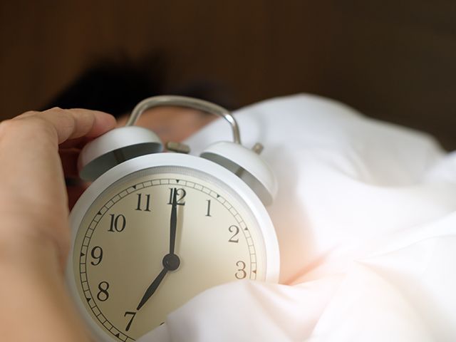 photo of person holding alarm clock 1028741