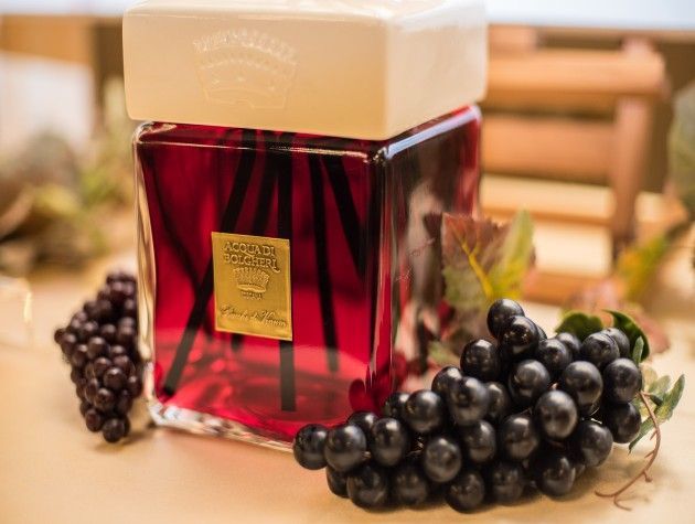 scented reed diffuser surrounded by grapes copy