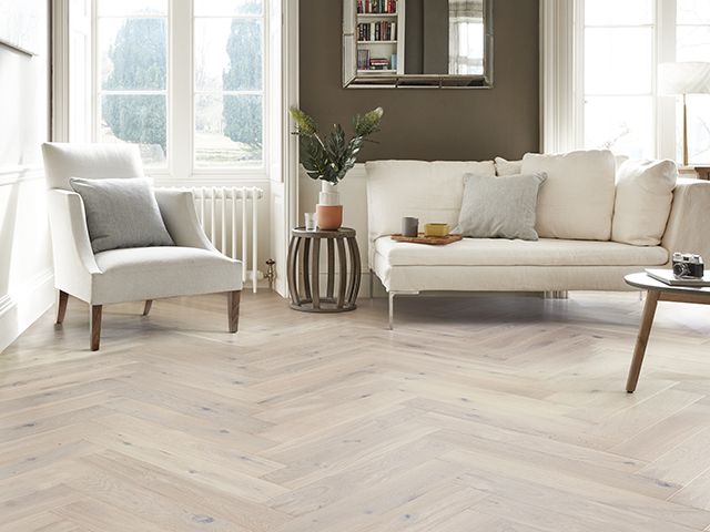 living room with white wood flooring - goodhomesmagazine.com