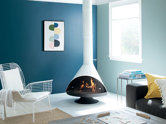 retro living room painted in blue - goodhomesmagazine.com