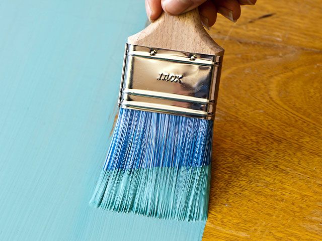 blue paintbrush stroke - how to update a Mid-Century side table - inspiration - goodhomesmagazine.com