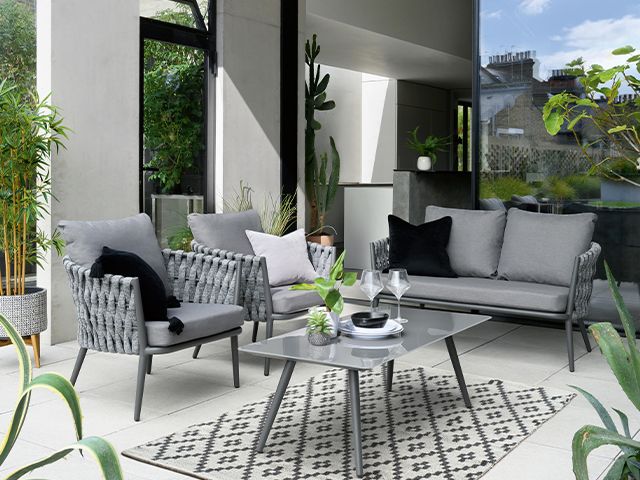 grey outdoor garden space - 6 stylish al fresco dining ideas - garden - goodhomesmagazine.com