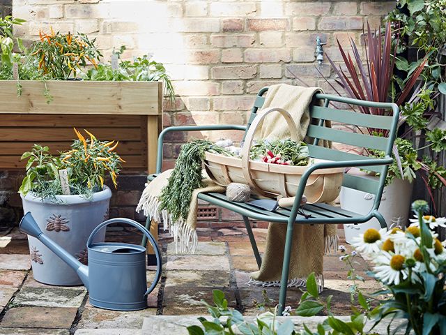 outdoor plants in garden - how to create a cosy garden seating area - garden - goodhomesmagazine.com