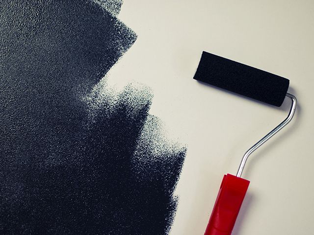 paint roller on wall - top tips on painting your home during lockdown - inspiration - goodhomesmagazine.com