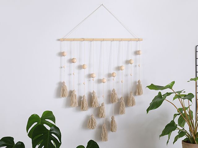 tassel boho wall hanging - DIY crafting: how to make a tassel wall hanging - inspiration - goodhomesmagazine.com