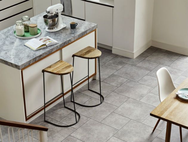 tiled kitchen with island and stools