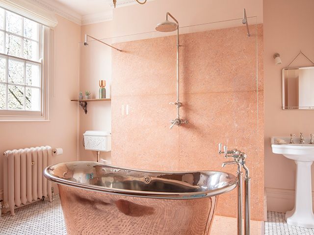 copper bathroom with bathtub - home tours - goodhomesmagazine.com