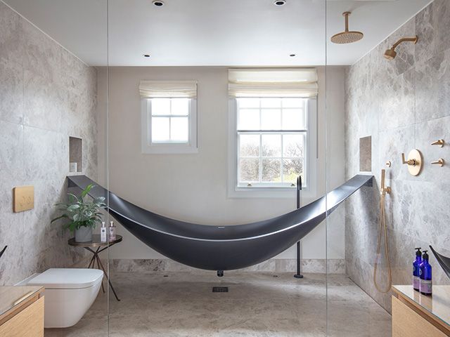 bathroom with modern hammock bath - home tours - goodhomesmagazine.com