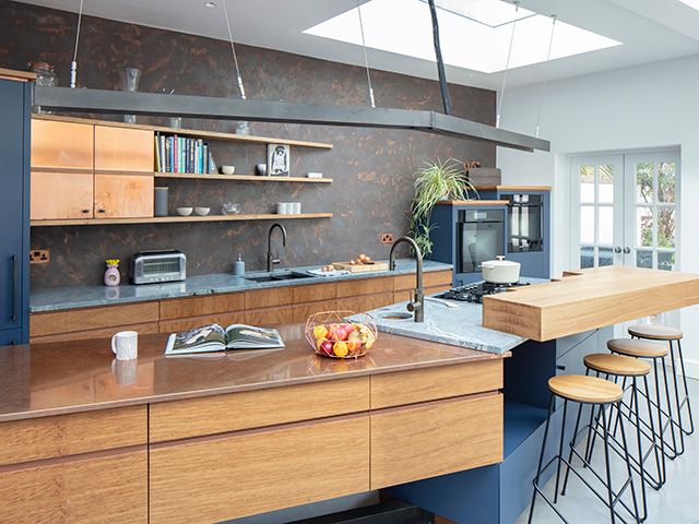 modern kitchen with metallic accents - home tour - goodhomesmagazine.com
