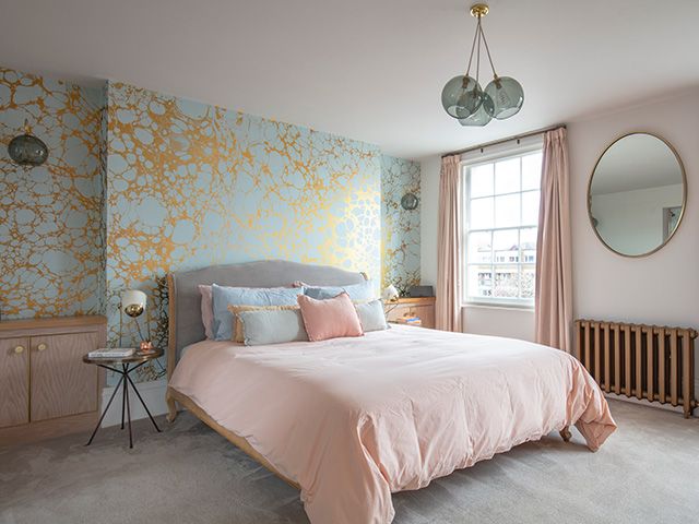modern bedroom with marble mural wallpaper - home tour - goodhomesmagazine.com
