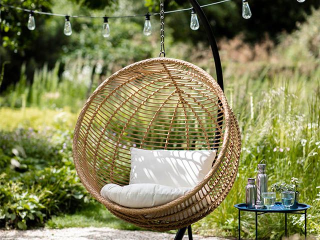 brown rattan hanging chair - 5 stylish hanging egg chairs for your garden - garden - goodhomesmagazine.com