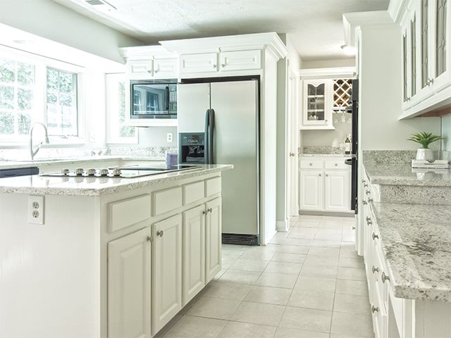 fridge freezer in neutral kitchen - 6 tips to keep your freezer efficient - kitchen - goodhomesmagazine.com