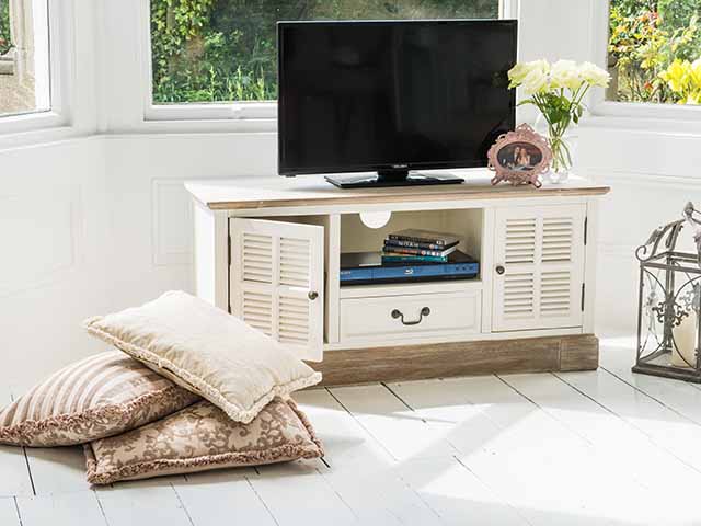 tv on wood tv stand - experts answer the 10 most common cleaning questions - inspiration - goodhomesmagazine.com